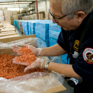 FDA inspector taking samples of food from the field. 